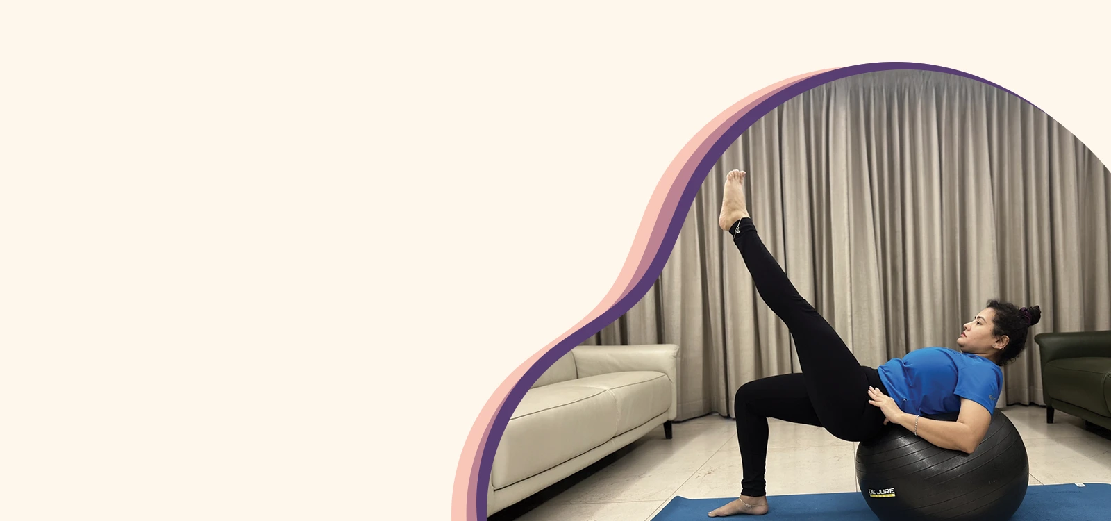 Woman performing core strengthening exercise on a stability ball with one leg raised